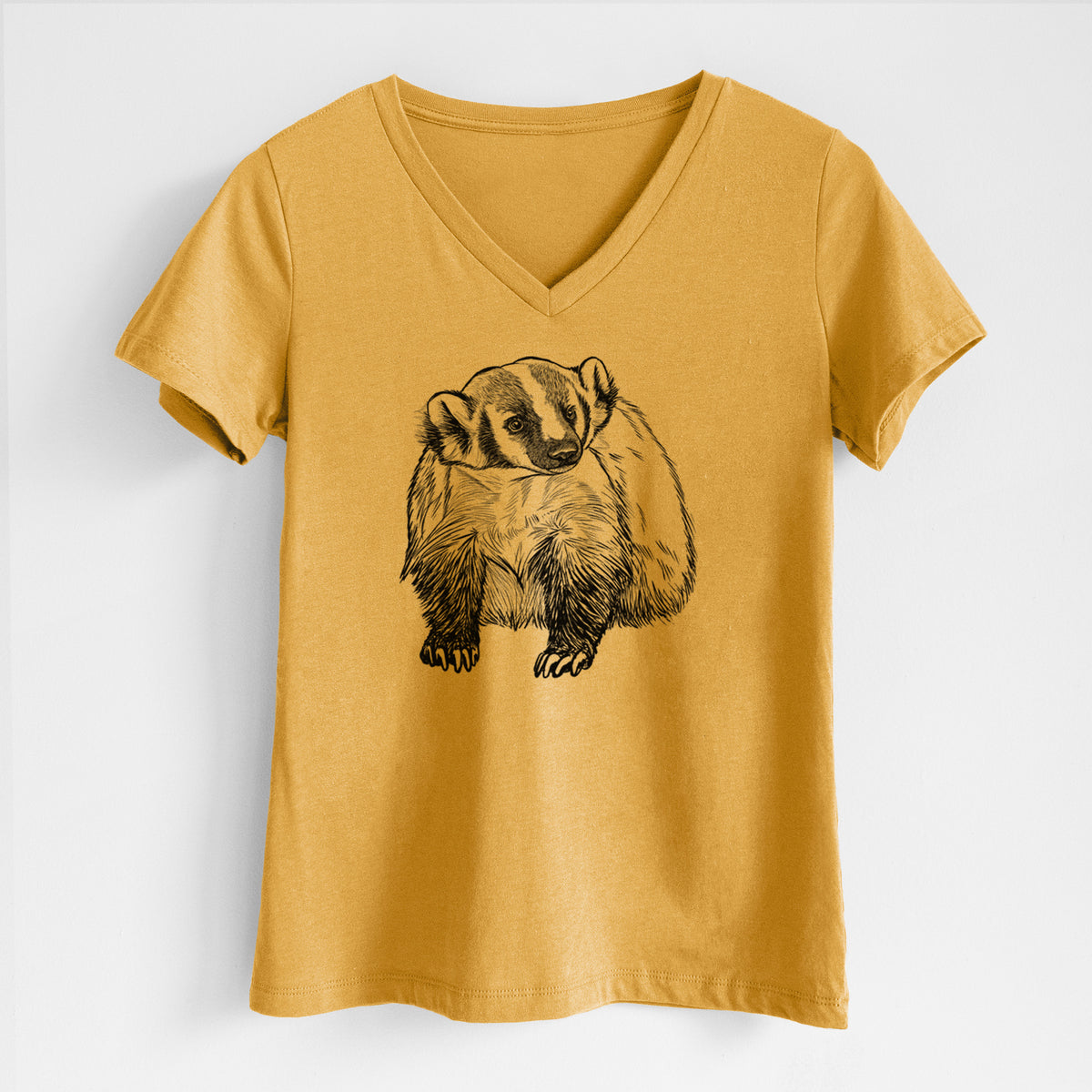 Honeycomb yellow women's relaxed fit cotton V-neck t-shirt laid flat, printed with a detailed black ink illustration of an American badger facing forward.