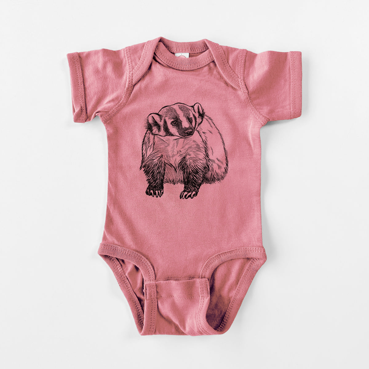 Mauve pink baby bodysuit laid flat, printed with a detailed black ink illustration of an American badger facing forward.
