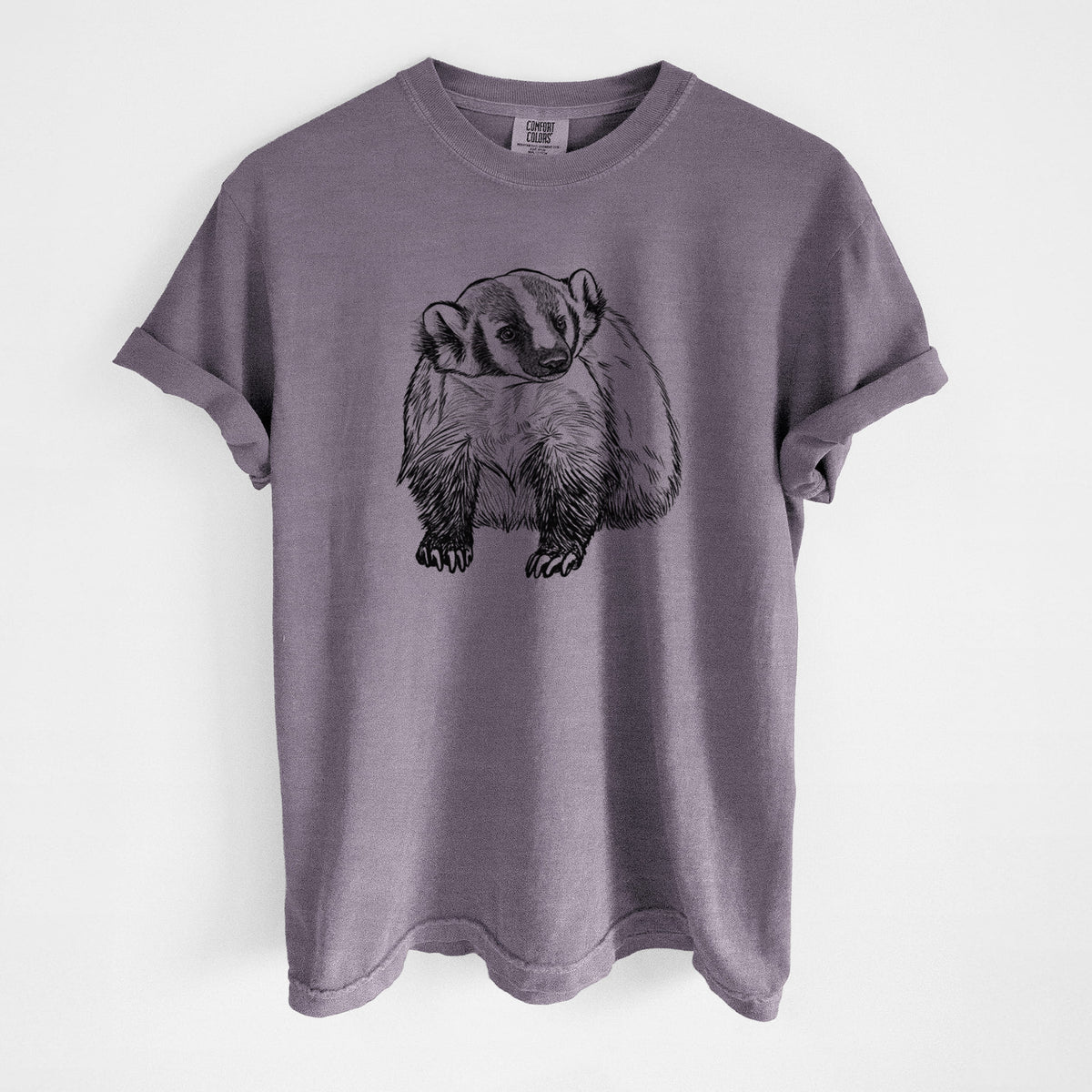 Wine red Comfort Colors t-shirt laid flat, printed with a detailed black ink illustration of an American badger facing forward.