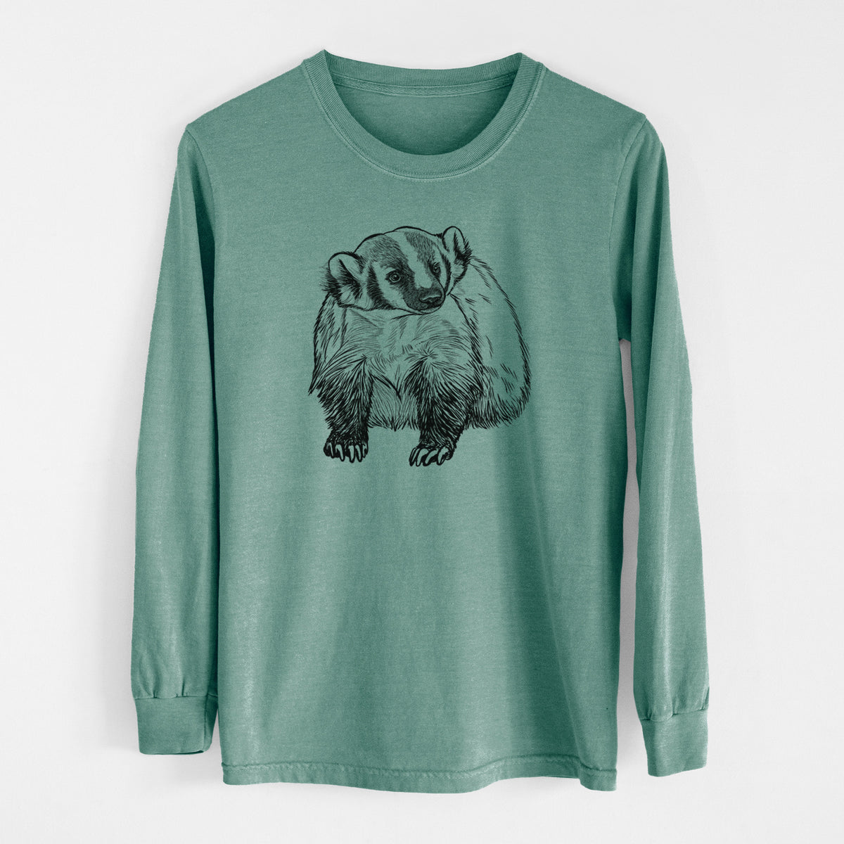 Pine green Comfort Colors long sleeve shirt laid flat, printed with a detailed black ink illustration of an American badger facing forward.