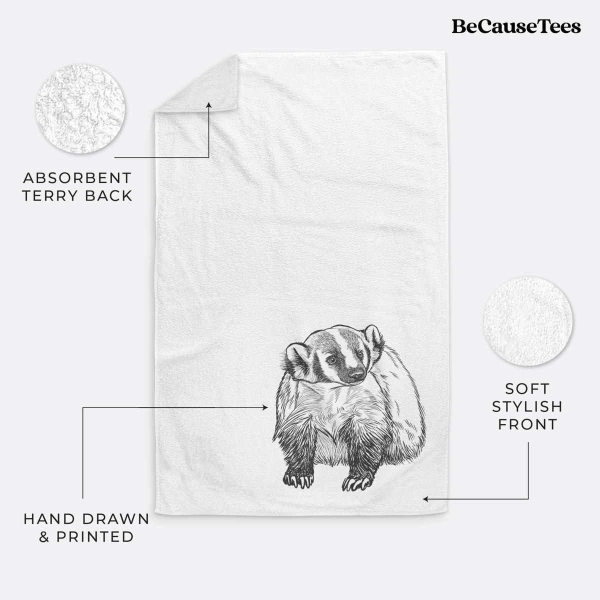 White hand towel printed with a detailed black ink illustration of an American badger facing forward.