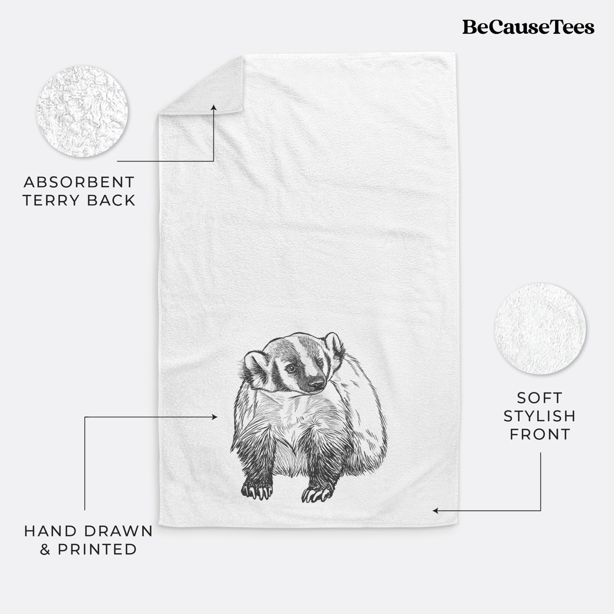 White hand towel printed with a detailed black ink illustration of an American badger facing forward.
