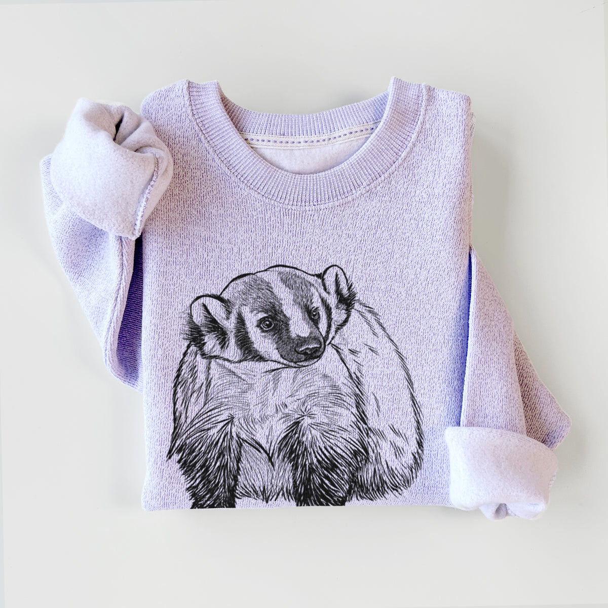 Ice purple knit sweatshirt printed with a detailed black ink illustration of an American badger facing forward, styled flat.