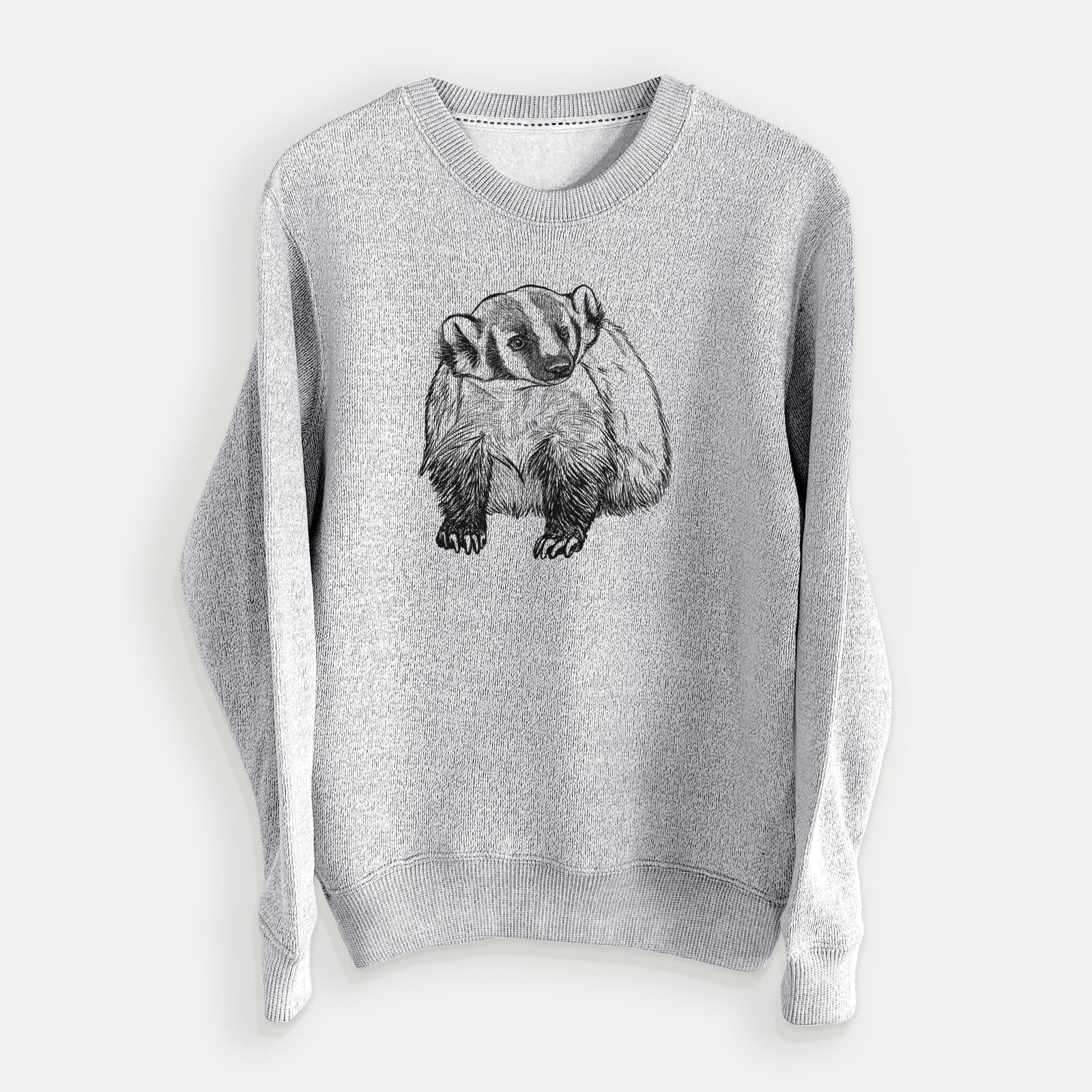 Salt and pepper knit sweatshirt laid flat, printed with a detailed black ink illustration of an American badger facing forward.