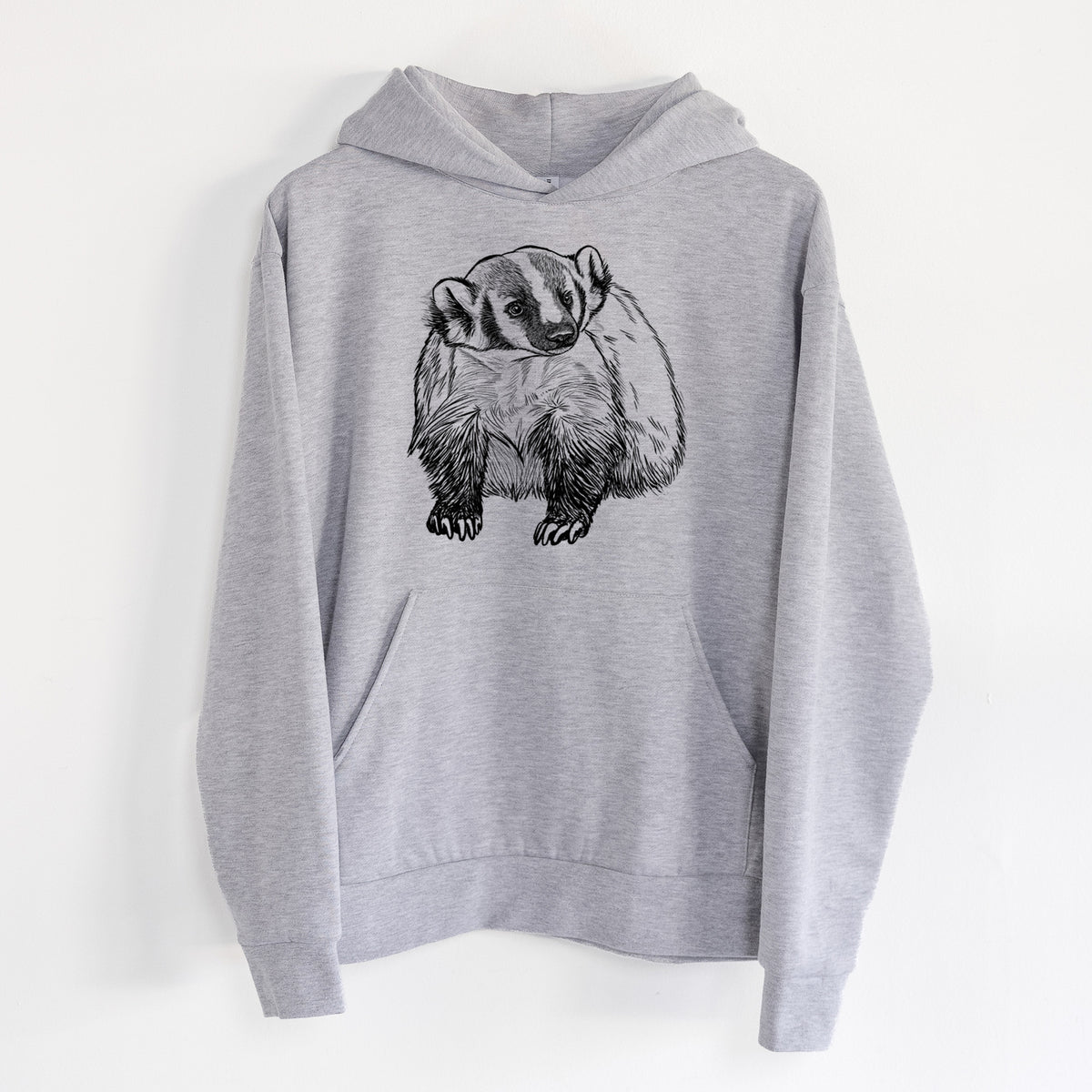 American Badger - Taxidea taxus - Statement Midweight Hoodie in Heather Grey, hanging on a white wall, with a front kangaroo pocket and no drawcords.