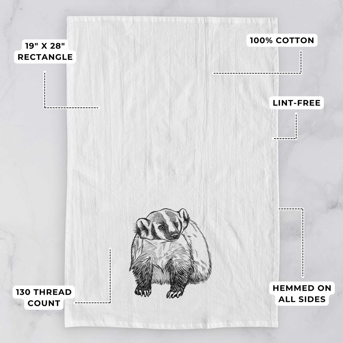White tea towel printed with a detailed black ink illustration of an American badger facing forward, with feature labels: 19 by 28 inch rectangle, 100% cotton, lint-free, 130 thread count, hemmed on all sides.