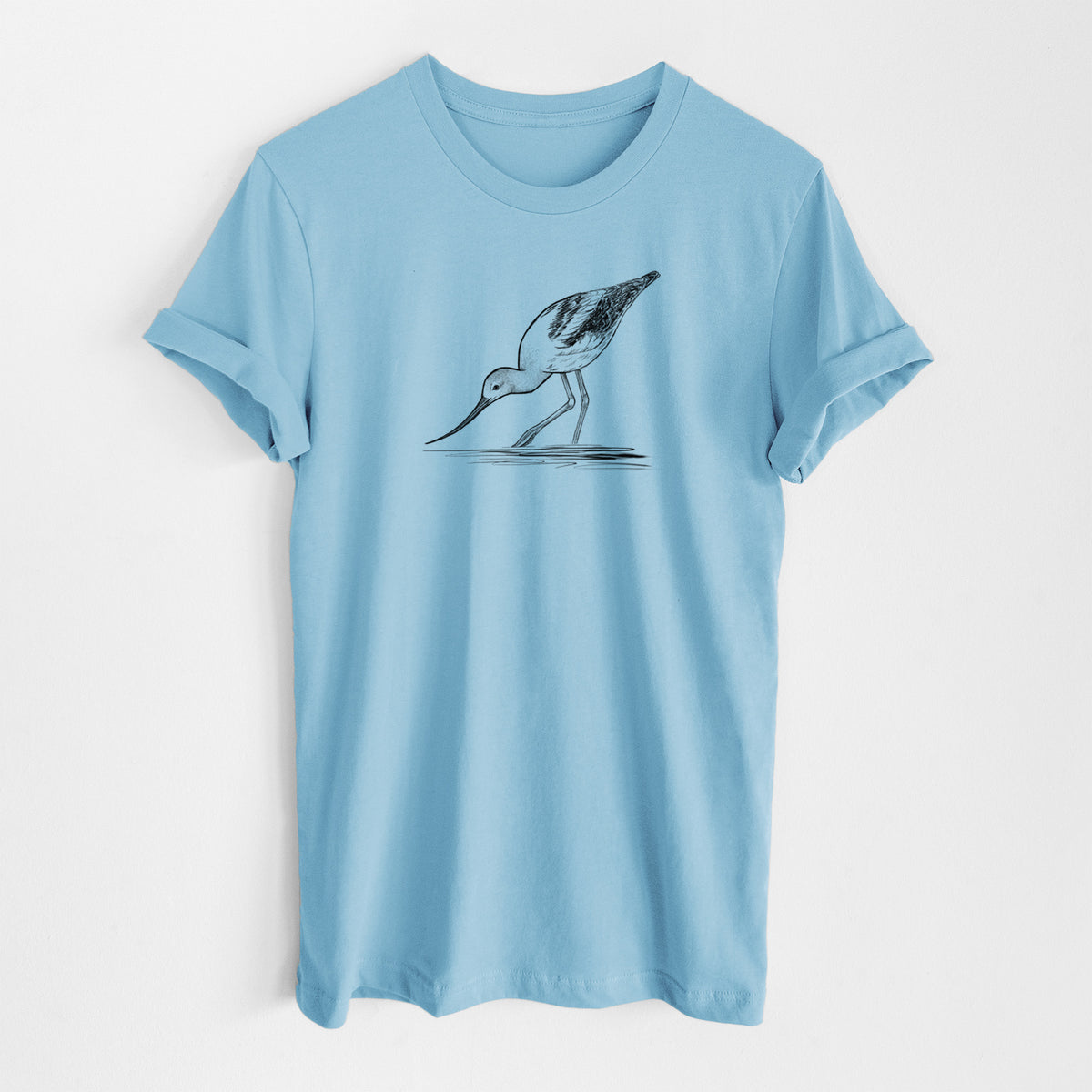 Ocean blue lightweight cotton t-shirt laid flat, printed with a detailed black ink sketch of an American avocet wading in shallow water.
