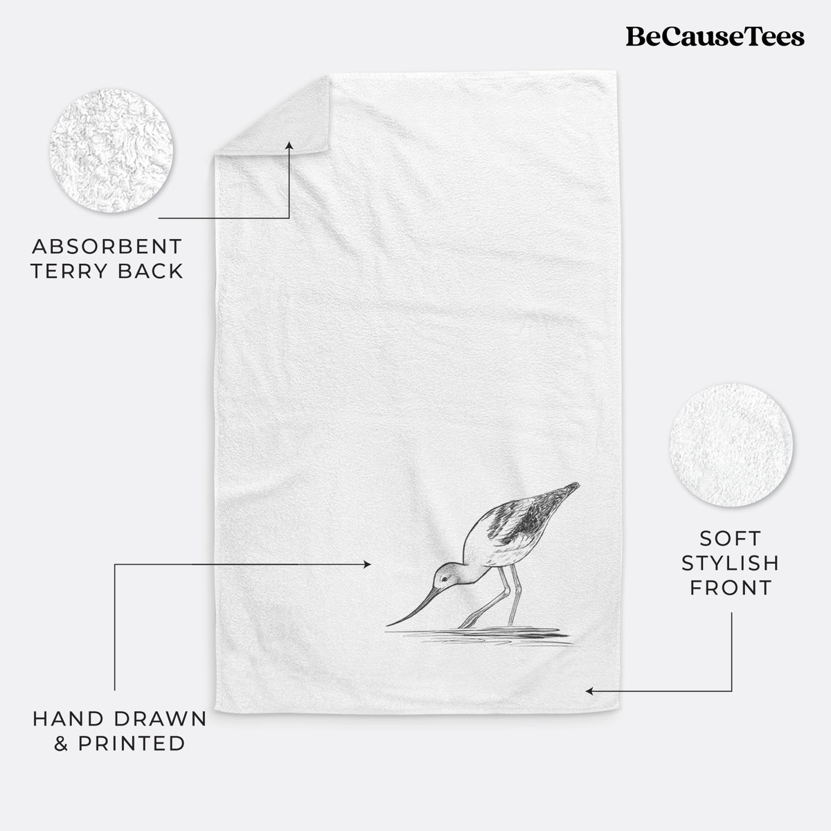 White hand towel printed with a detailed black ink sketch of an American avocet wading in shallow water.