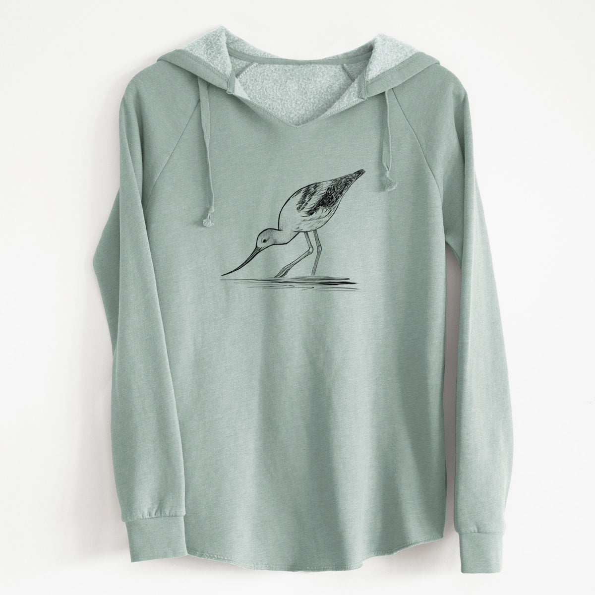 Sage green women's Cali Wave hooded sweatshirt laid flat, printed with a detailed black ink sketch of an American avocet wading in shallow water.