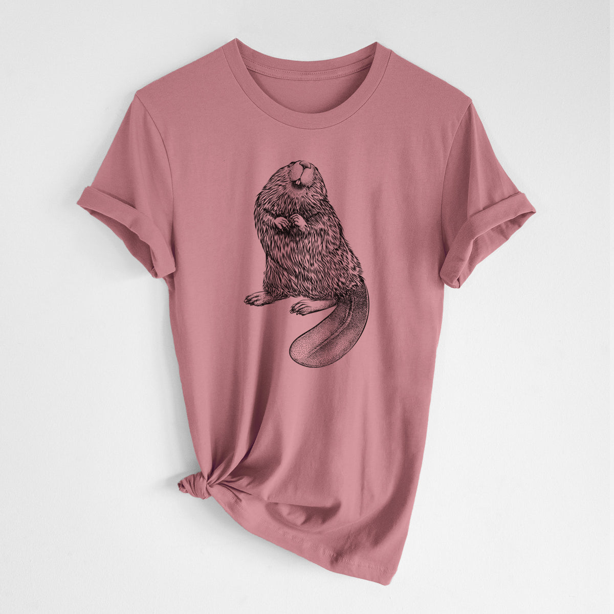 Mauve pink lightweight cotton t-shirt laid flat with the sleeves rolled, printed with a detailed black ink illustration of an American beaver sitting upright with its flat tail.