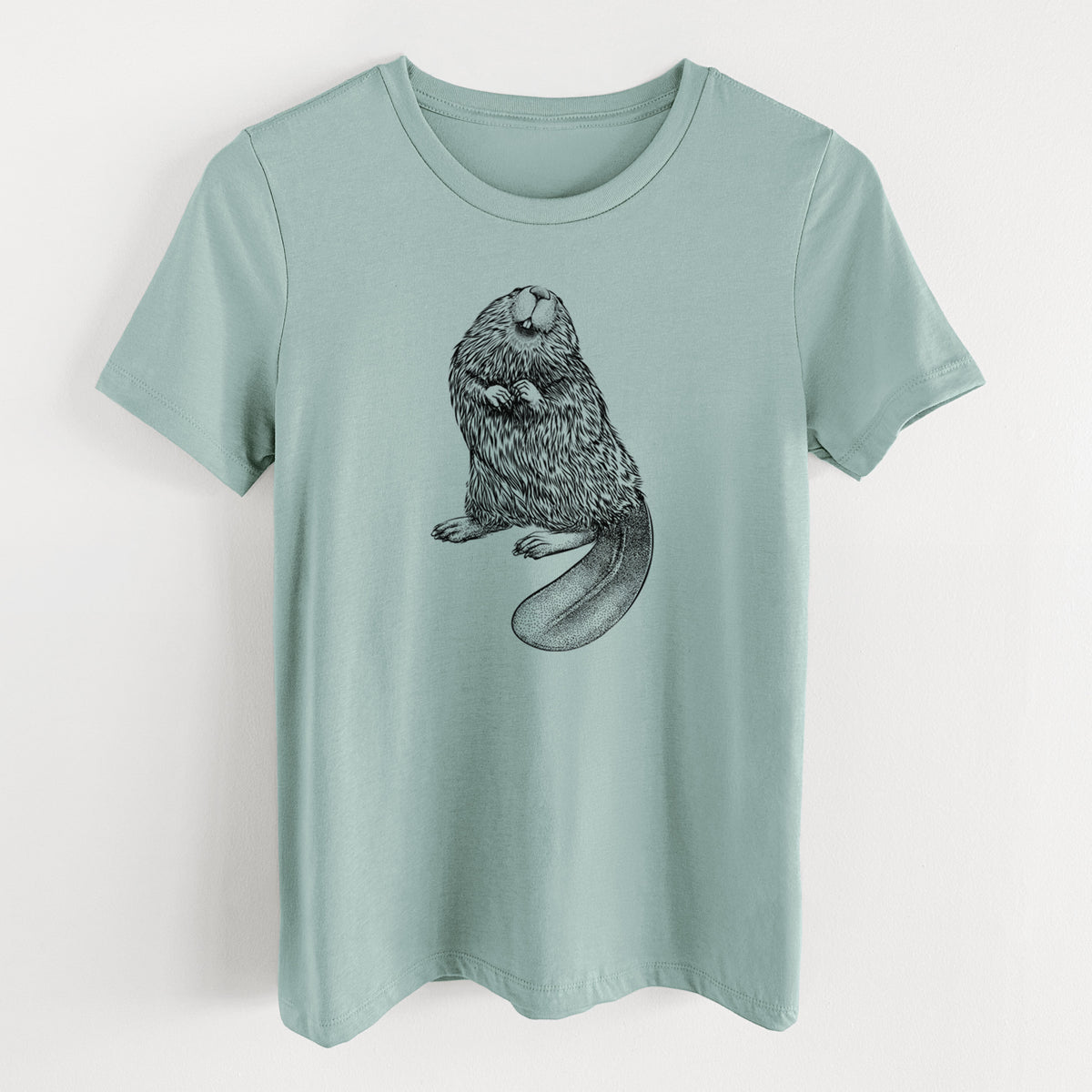 Dusty blue women's relaxed fit cotton t-shirt laid flat, printed with a detailed black ink illustration of an American beaver sitting upright with its flat tail.