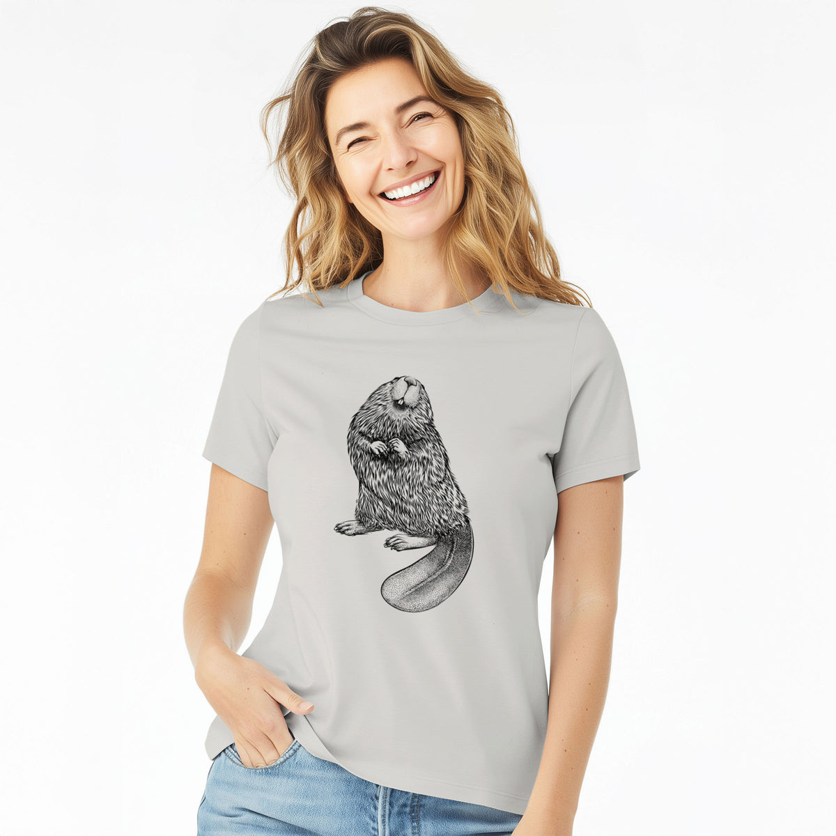Woman wearing a lunar grey women's relaxed fit cotton t-shirt printed with a detailed black ink illustration of an American beaver sitting upright with its flat tail.