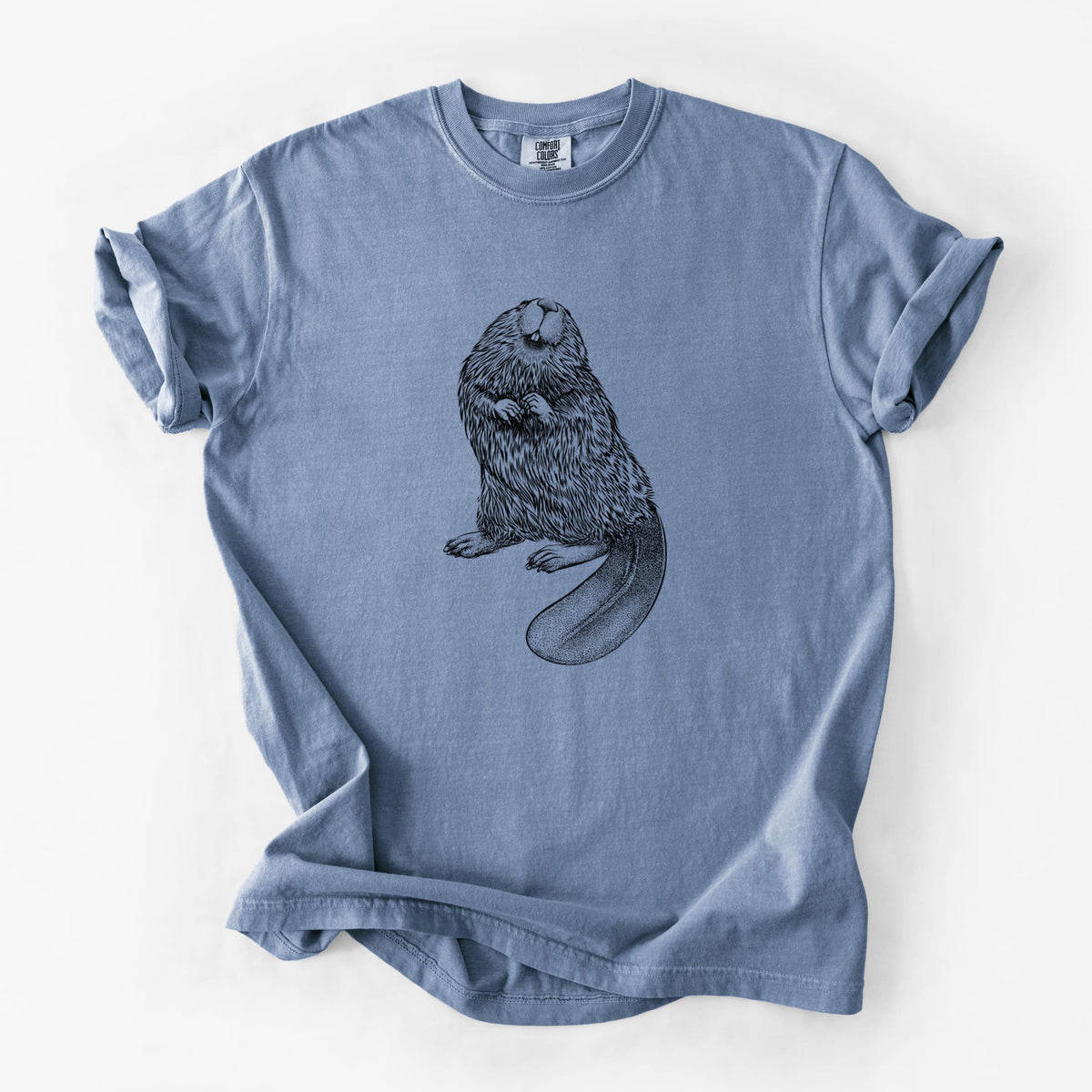 Blue jean Comfort Colors t-shirt laid flat, printed with a detailed black ink illustration of an American beaver sitting upright with its flat tail.