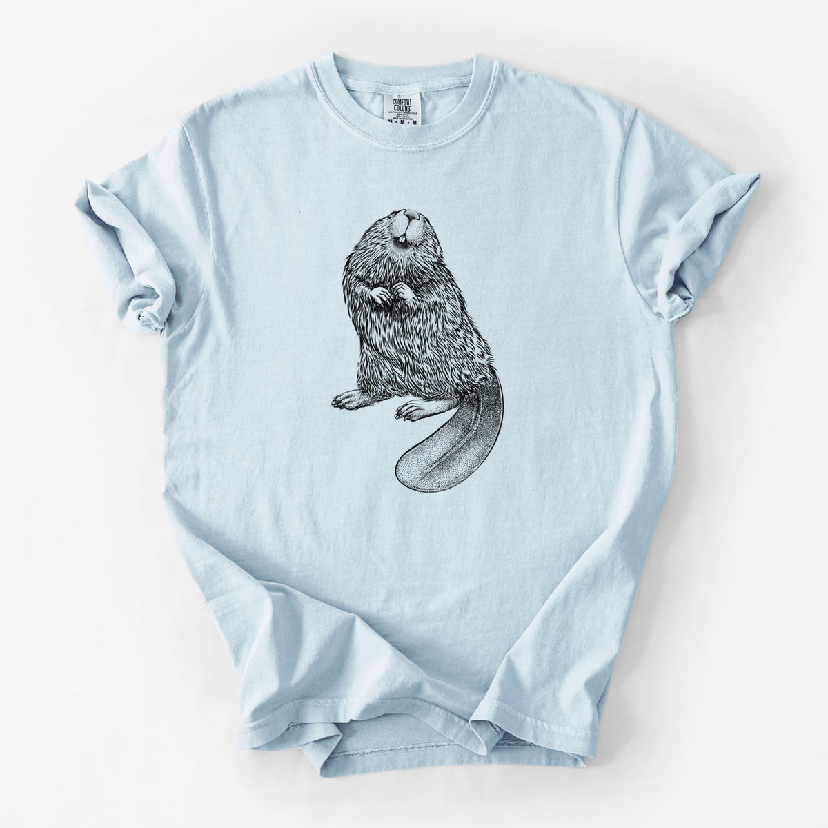 Chambray blue Comfort Colors t-shirt laid flat, printed with a detailed black ink illustration of an American beaver sitting upright with its flat tail.