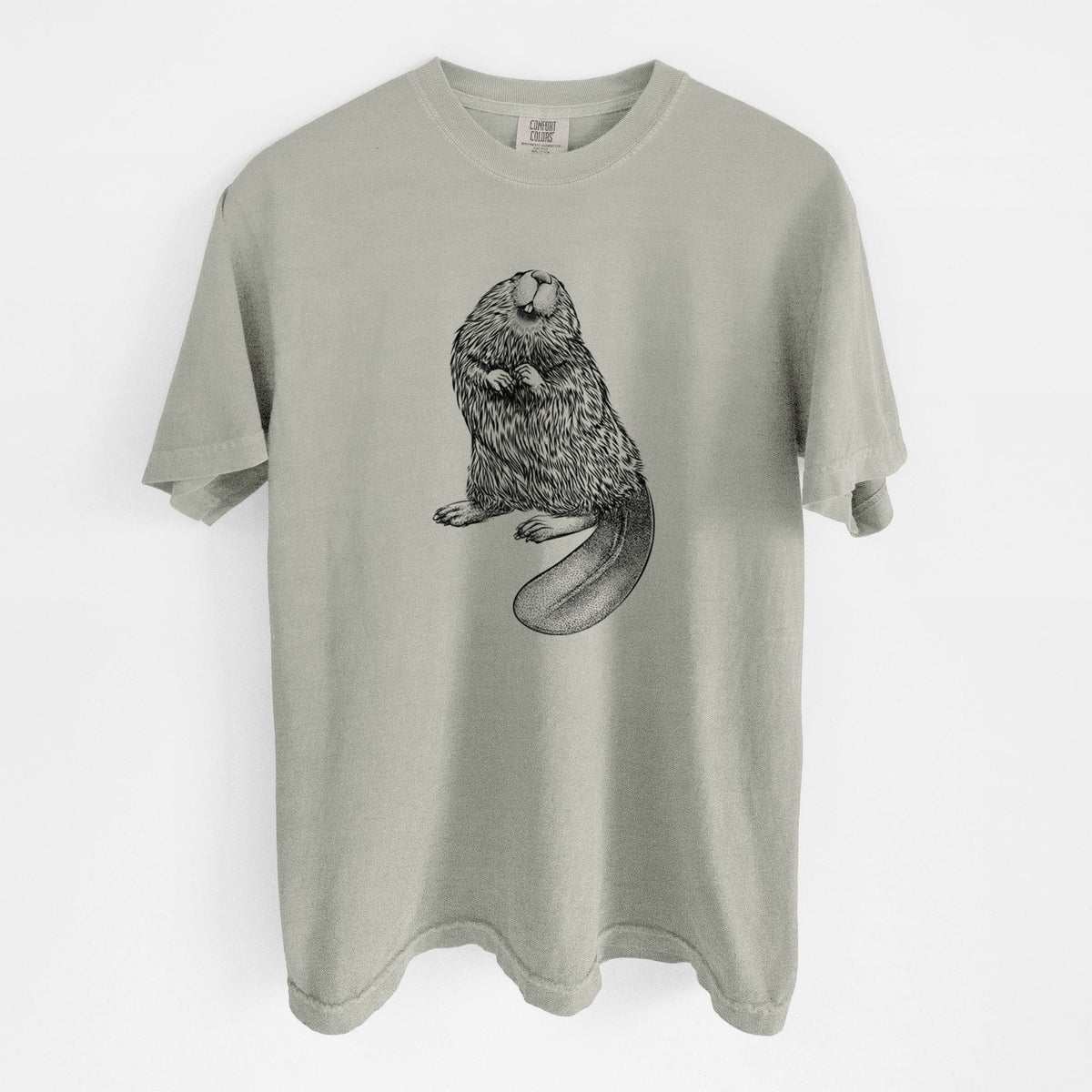 Sandstone beige Comfort Colors t-shirt laid flat, printed with a detailed black ink illustration of an American beaver sitting upright with its flat tail.