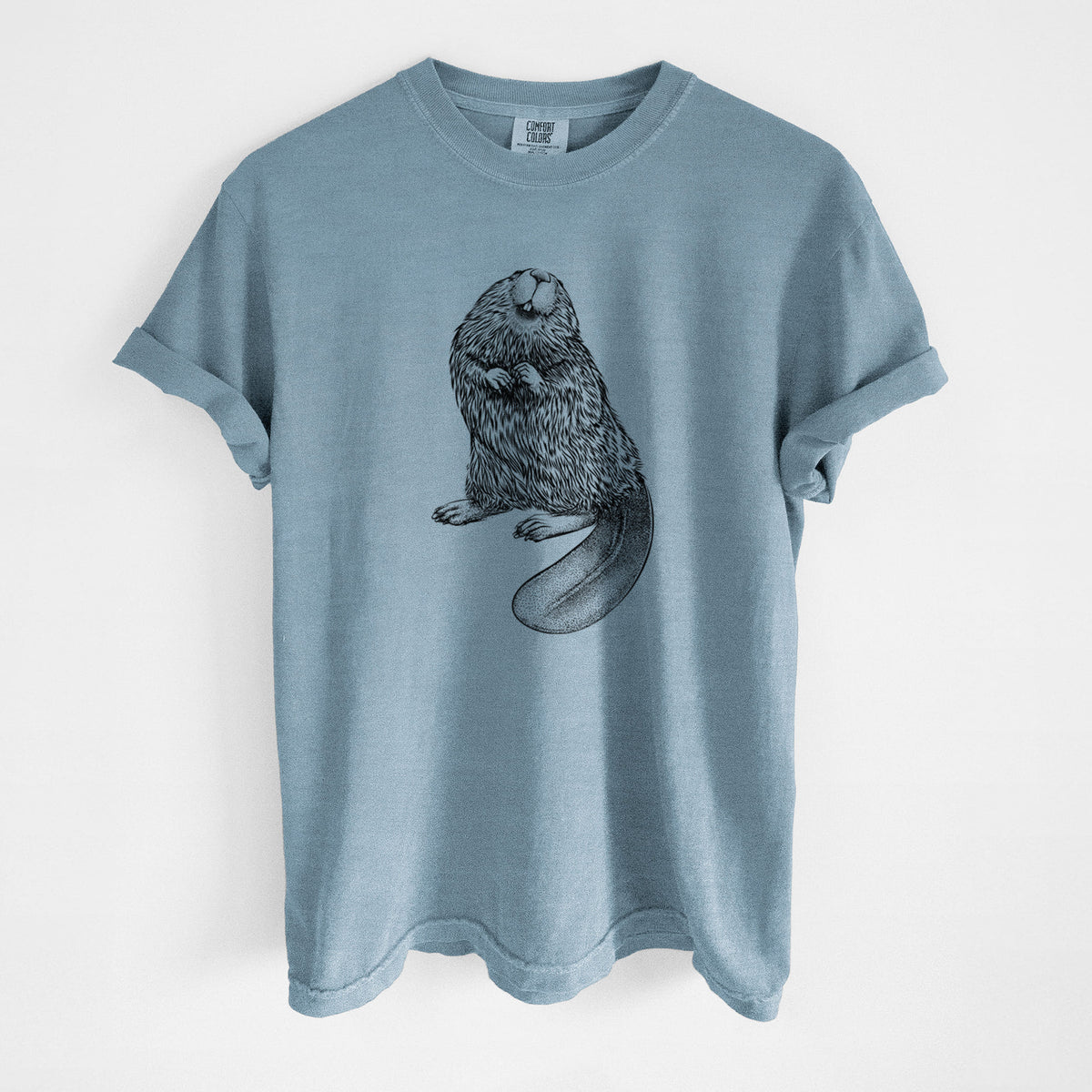 Steel blue Comfort Colors t-shirt laid flat, printed with a detailed black ink illustration of an American beaver sitting upright with its flat tail.