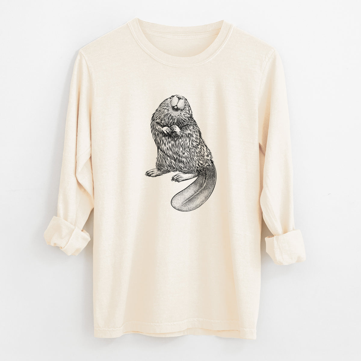 Ivory Comfort Colors long sleeve shirt laid flat with the cuffs rolled, printed with a detailed black ink illustration of an American beaver sitting upright with its flat tail.