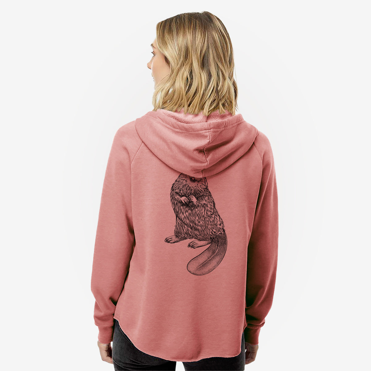 Woman wearing a dusty rose women's Cali Wave zip-up sweatshirt printed with a detailed black ink illustration of an American beaver sitting upright with its flat tail, seen from behind.