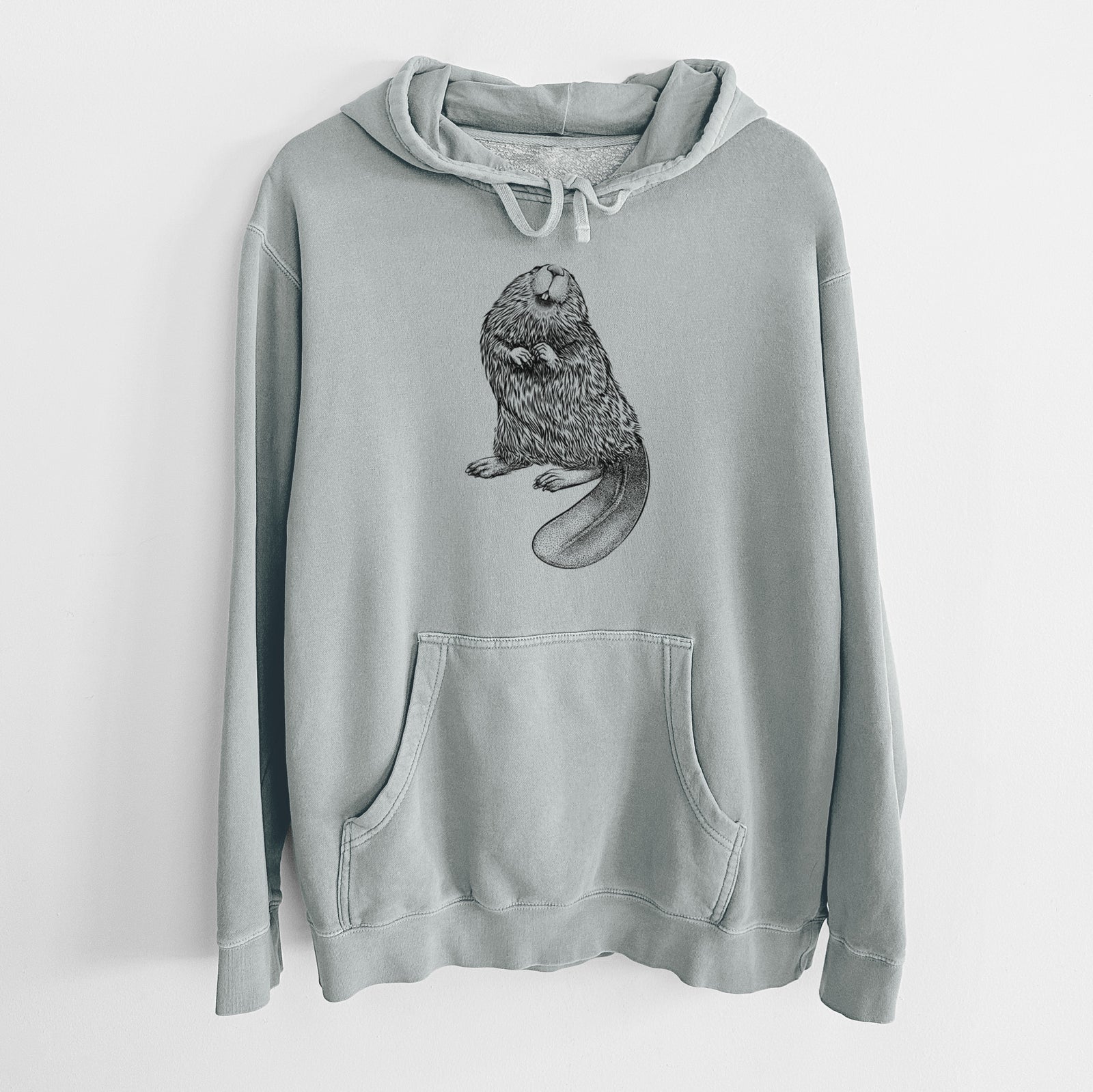 Sage green pigment dyed hoodie laid flat, printed with a detailed black ink illustration of an American beaver sitting upright with its flat tail.