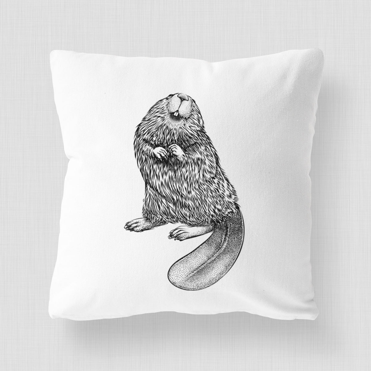 White pillow cover printed with a detailed black ink illustration of an American beaver sitting upright with its flat tail.