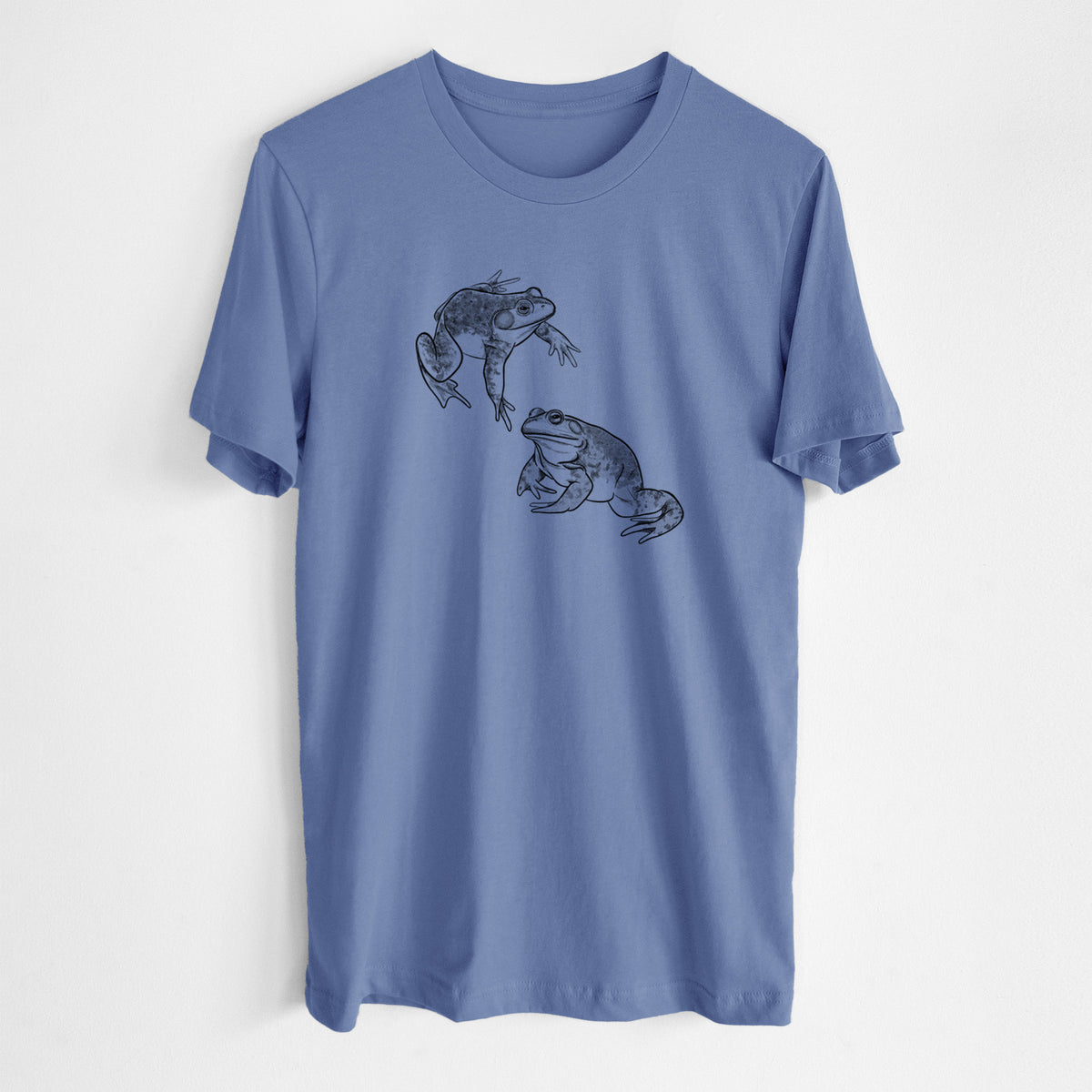 Blue bell lightweight cotton t-shirt laid flat, printed with a detailed black ink illustration of two American bullfrogs.