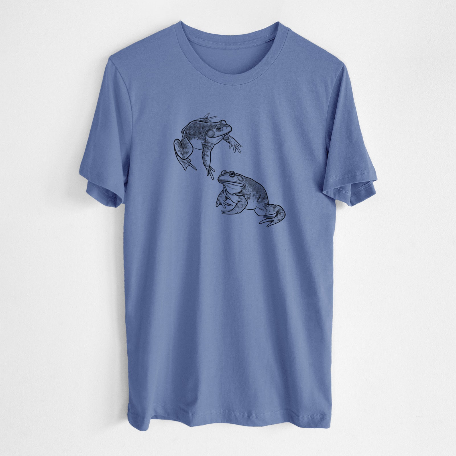 Blue bell lightweight cotton t-shirt laid flat, printed with a detailed black ink illustration of two American bullfrogs.