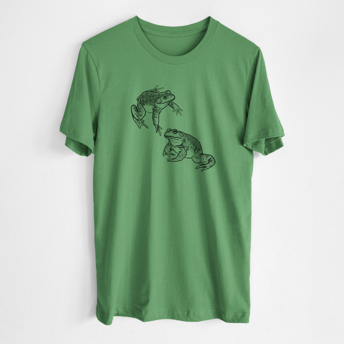 Leaf green lightweight cotton t-shirt laid flat, printed with a detailed black ink illustration of two American bullfrogs.
