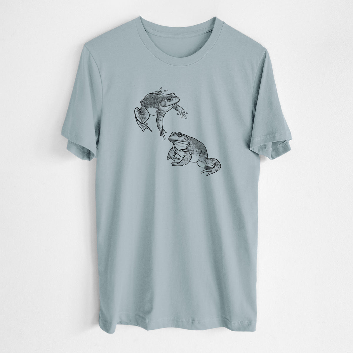 Vintage denim lightweight cotton t-shirt laid flat, printed with a detailed black ink illustration of two American bullfrogs.