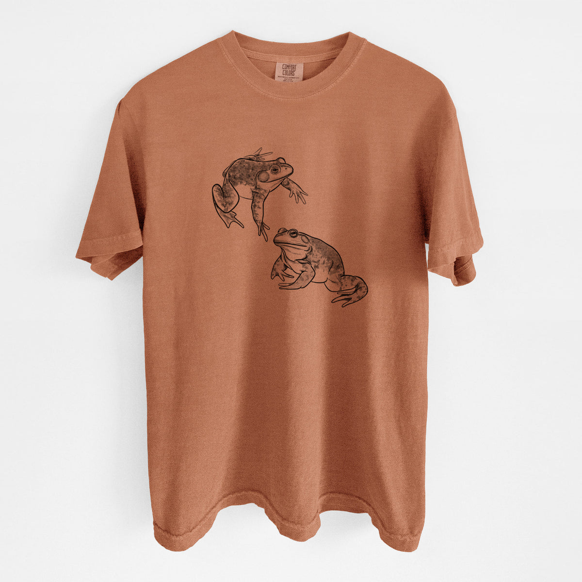Yam burnt orange Comfort Colors t-shirt laid flat, printed with a detailed black ink illustration of two American bullfrogs.