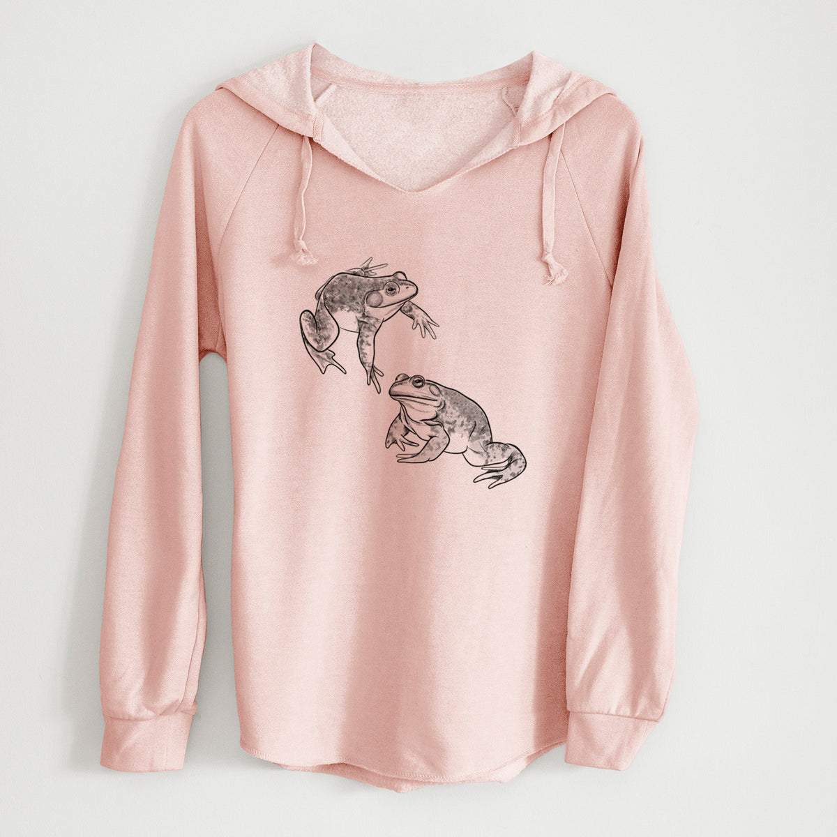 Blush pink women's Cali Wave hooded sweatshirt laid flat, printed with a detailed black ink illustration of two American bullfrogs.
