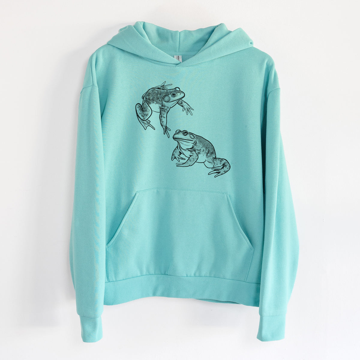 American Bullfrogs - Lithobates catesbeianus - Statement Midweight Hoodie in Seafoam, hanging on a white wall, with a front kangaroo pocket and no drawcords.