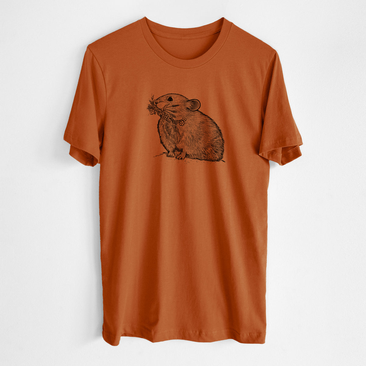 Autumn lightweight cotton t-shirt laid flat, printed with a detailed black ink illustration of an American pika holding flowers and grass in its mouth.