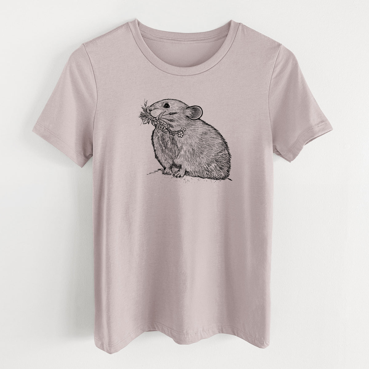 Pink gravel women's relaxed fit cotton t-shirt laid flat, printed with a detailed black ink illustration of an American pika holding flowers and grass in its mouth.