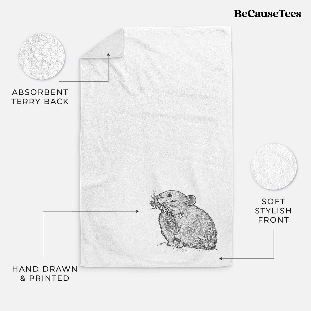 White hand towel printed with a detailed black ink illustration of an American pika holding flowers and grass in its mouth.