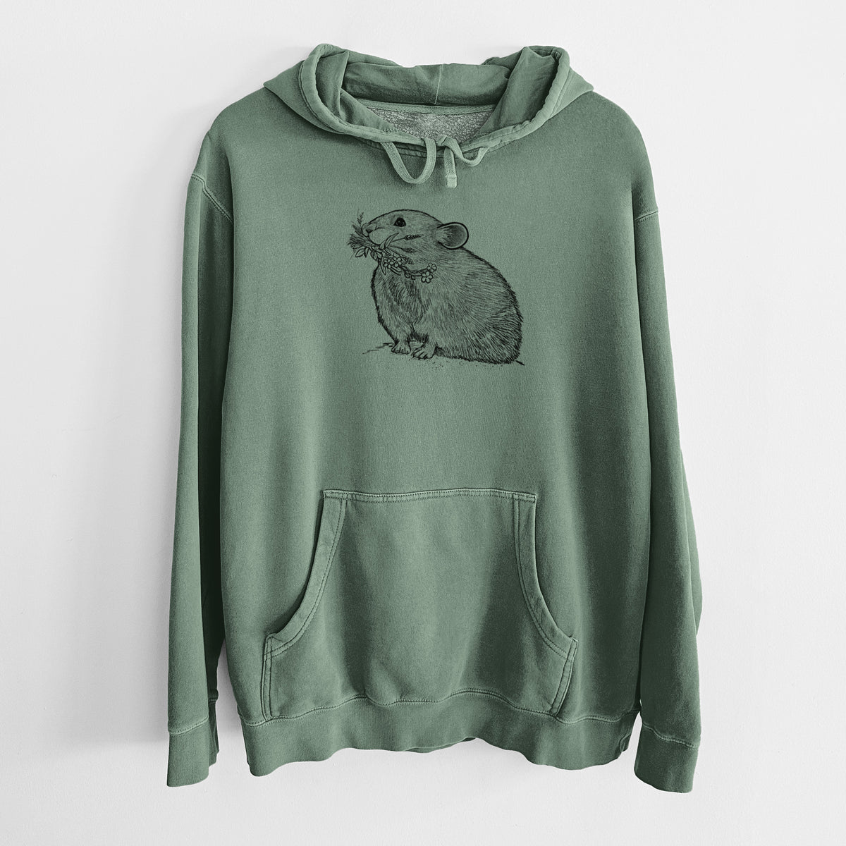 Alpine green pigment dyed hoodie laid flat, printed with a detailed black ink illustration of an American pika holding flowers and grass in its mouth.
