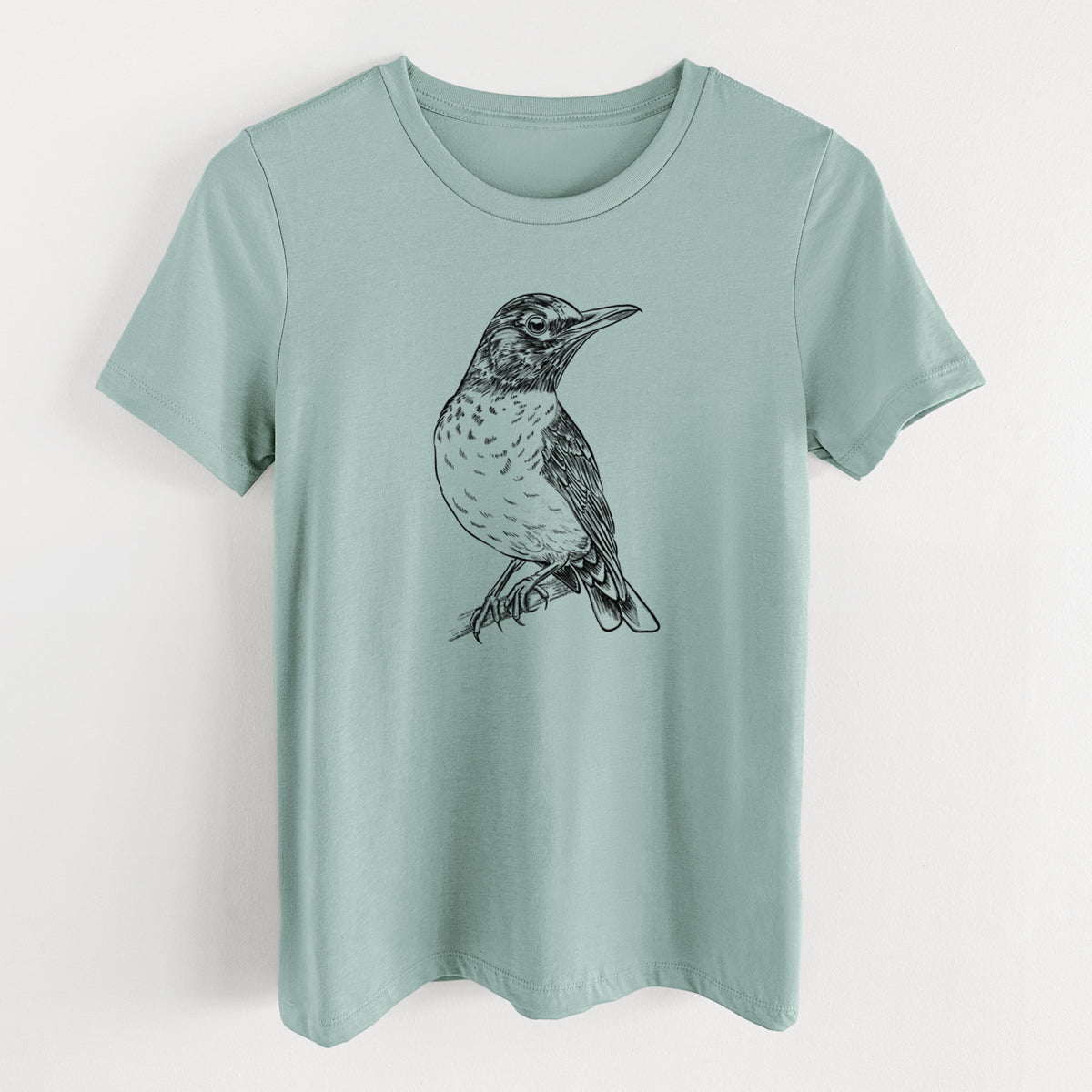 Dusty blue women's relaxed fit cotton t-shirt laid flat, printed with a detailed black ink sketch of an American robin perched on a branch.