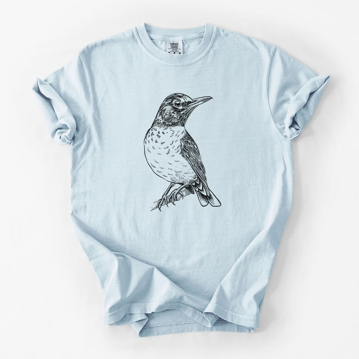 Chambray blue Comfort Colors t-shirt laid flat, printed with a detailed black ink sketch of an American robin perched on a branch.