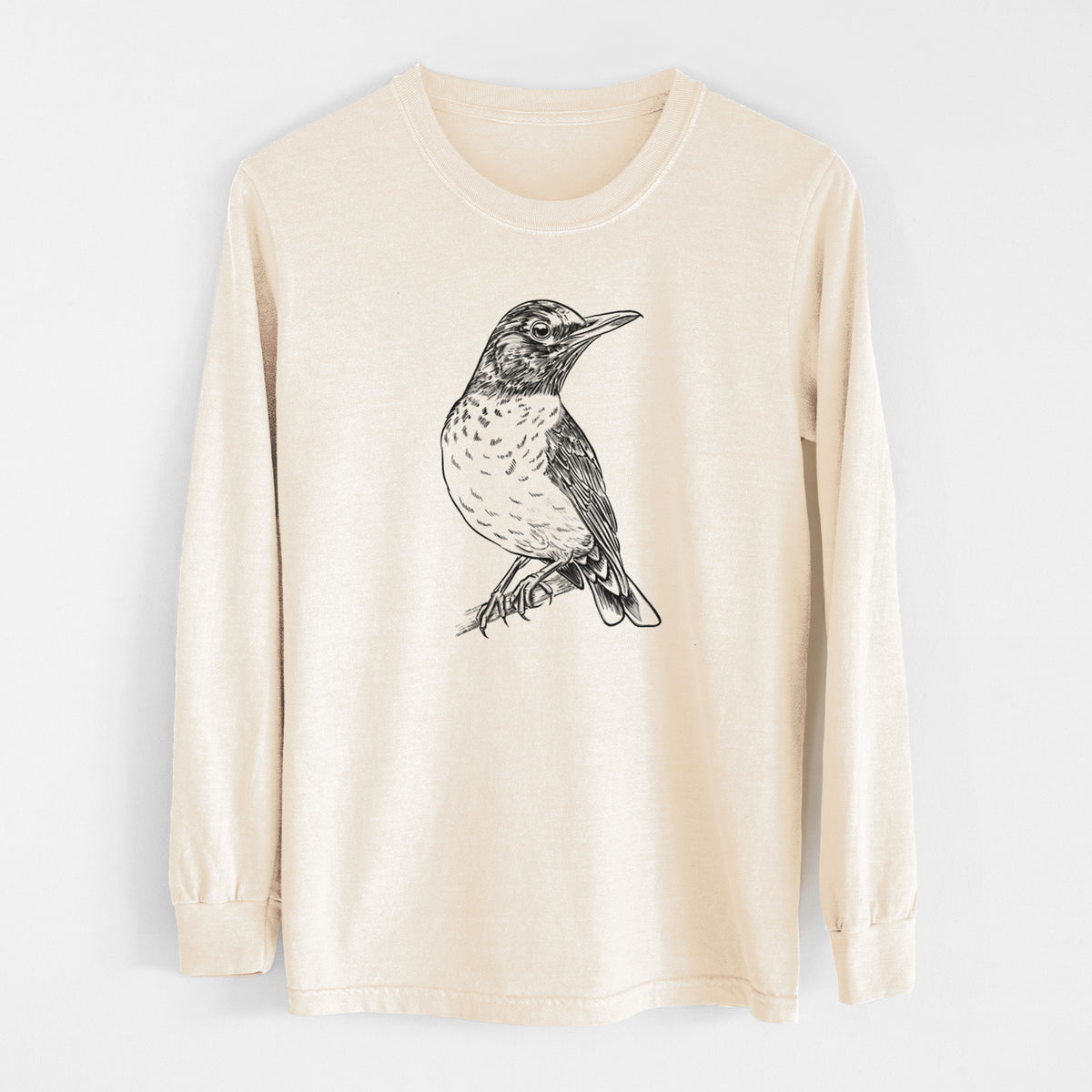 Ivory Comfort Colors long sleeve shirt laid flat, printed with a detailed black ink sketch of an American robin perched on a branch.