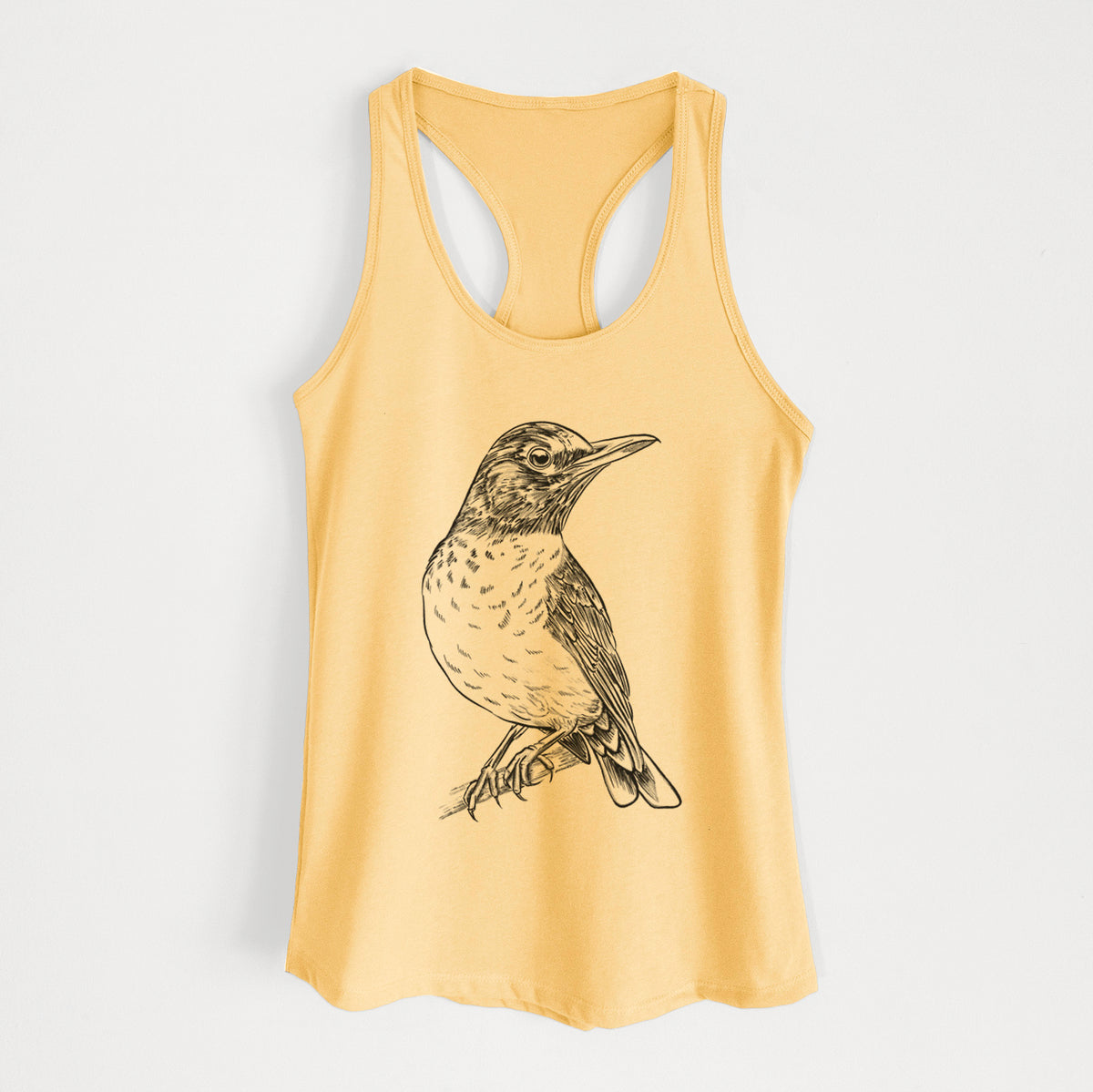 Banana cream women's racerback tank top laid flat, printed with a detailed black ink sketch of an American robin perched on a branch.