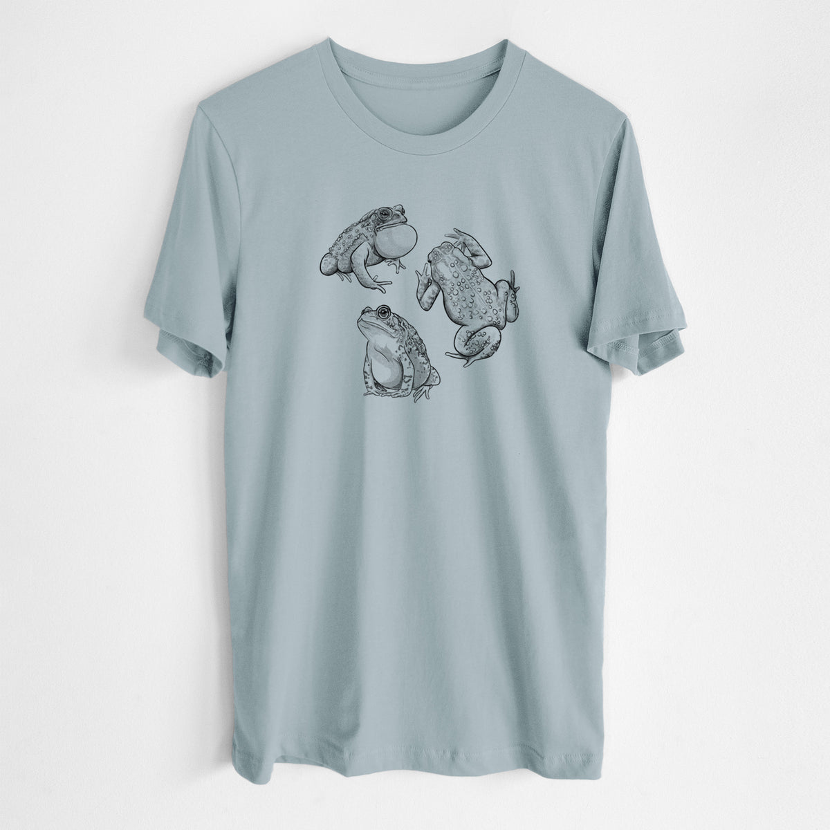 Vintage denim lightweight cotton t-shirt laid flat, printed with a black ink illustration of three American toads.