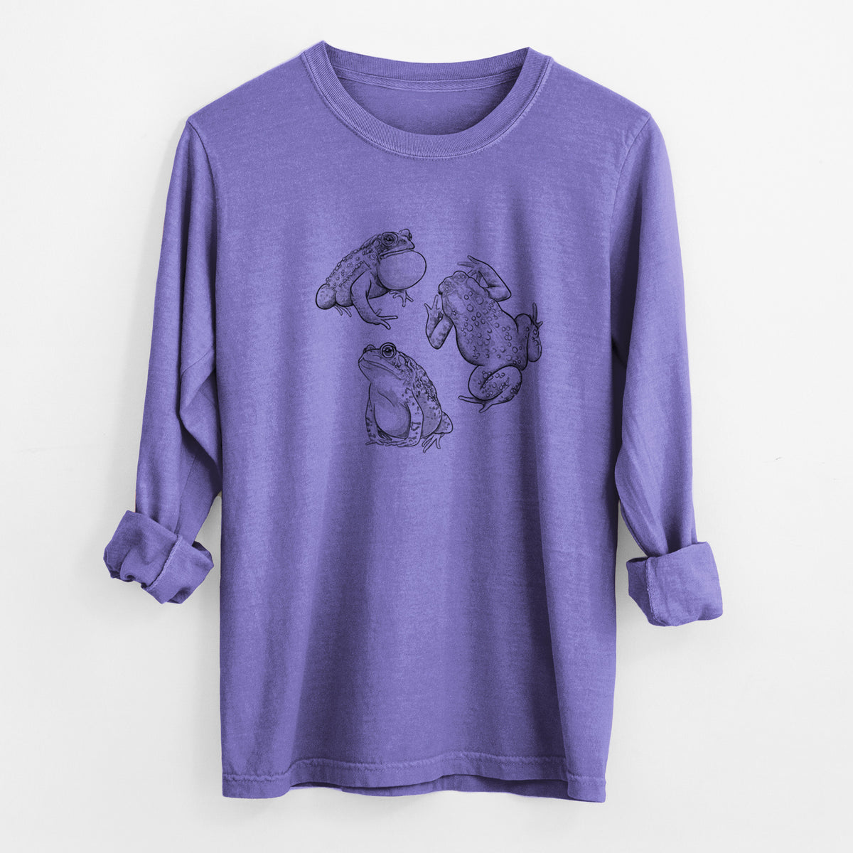 Violet purple Comfort Colors long sleeve shirt laid flat with the cuffs rolled, printed with a black ink illustration of three American toads.