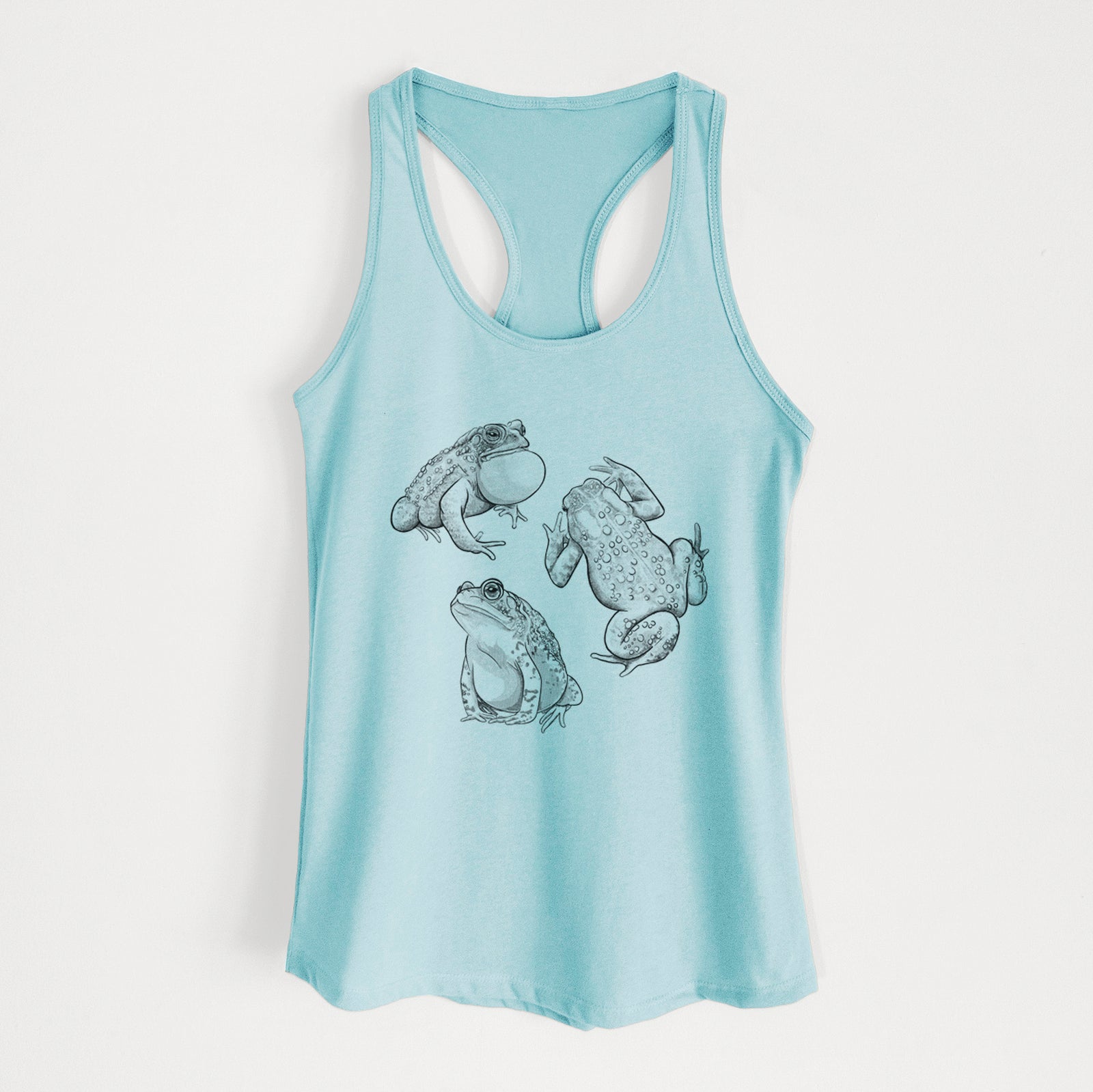 Cancun blue women's racerback tank top laid flat, printed with a black ink illustration of three American toads.