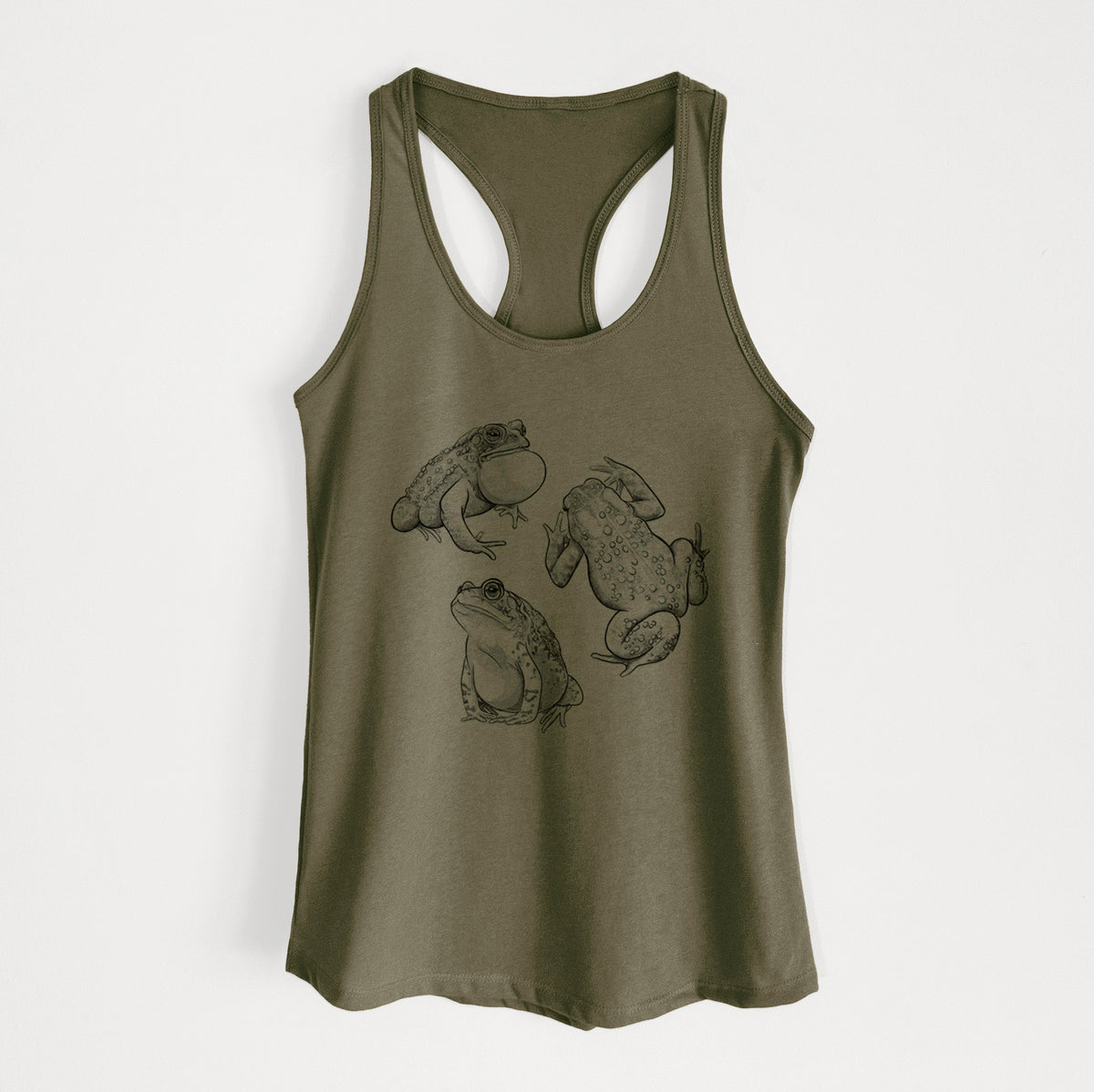 Military green women's racerback tank top laid flat, printed with a black ink illustration of three American toads.