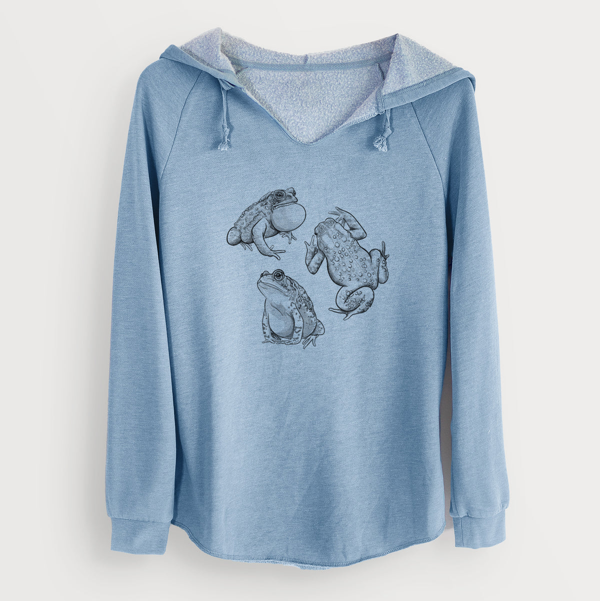 Misty blue women's Cali Wave hooded sweatshirt laid flat, printed with a black ink illustration of three American toads.