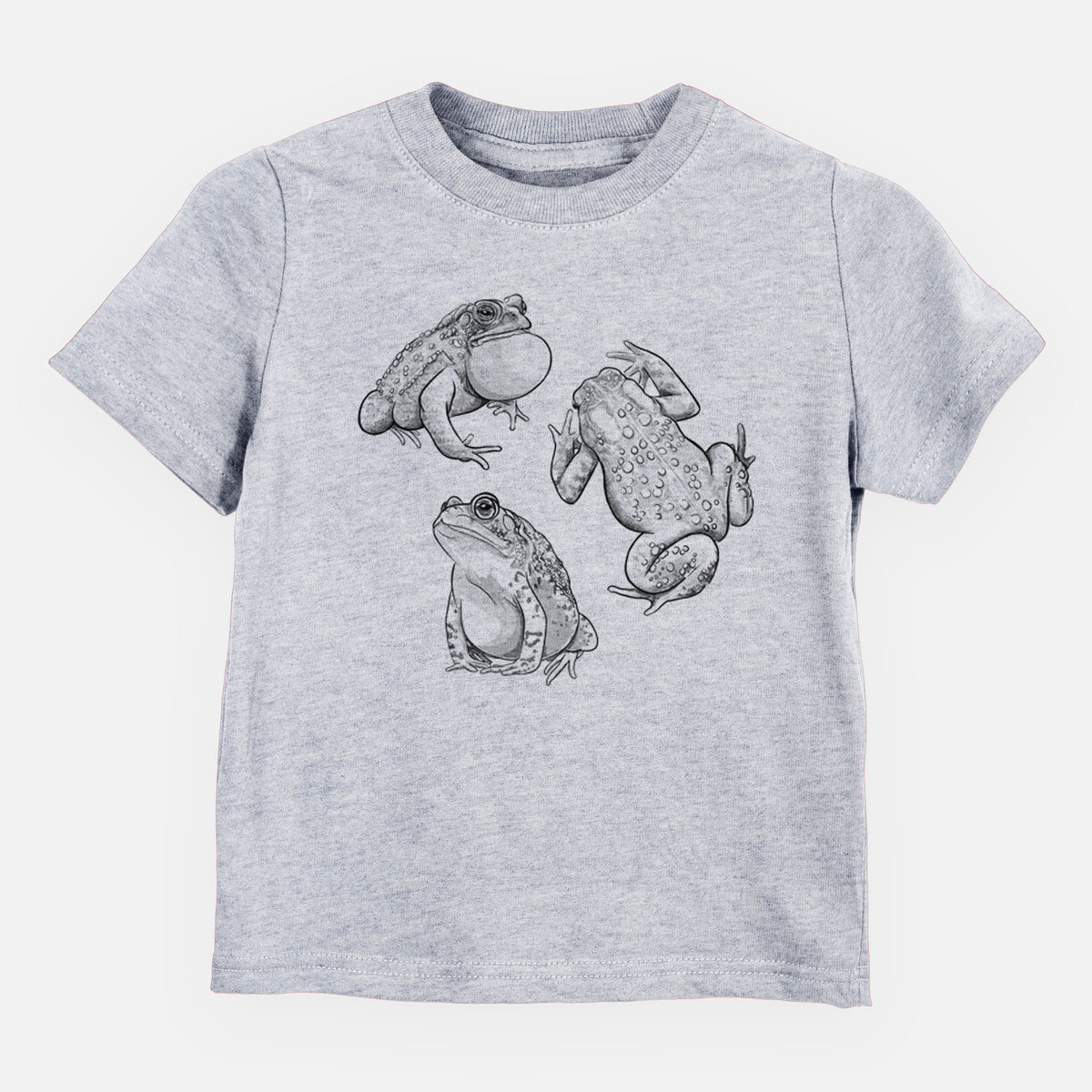 Heather grey toddler t-shirt laid flat, printed with a black ink illustration of three American toads.