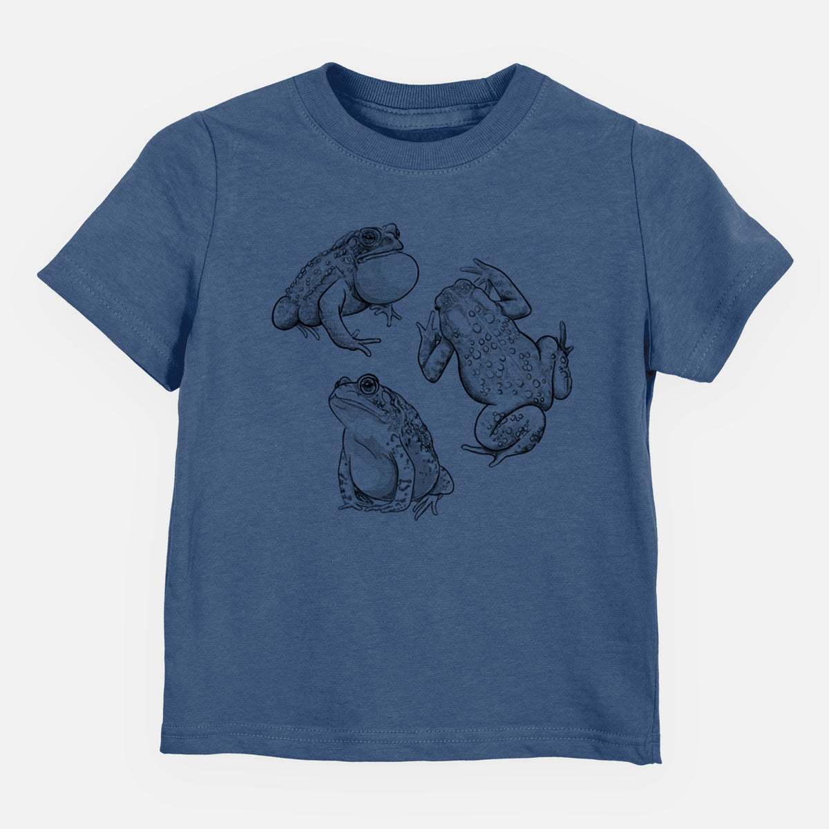 Indigo blue toddler t-shirt laid flat, printed with a black ink illustration of three American toads.