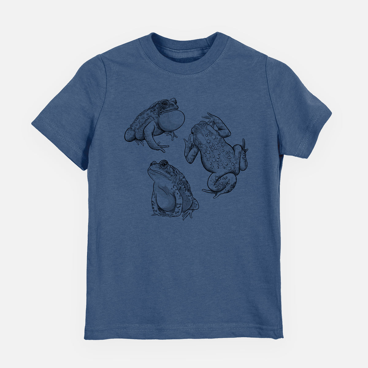 Indigo blue youth t-shirt laid flat, printed with a black ink illustration of three American toads.