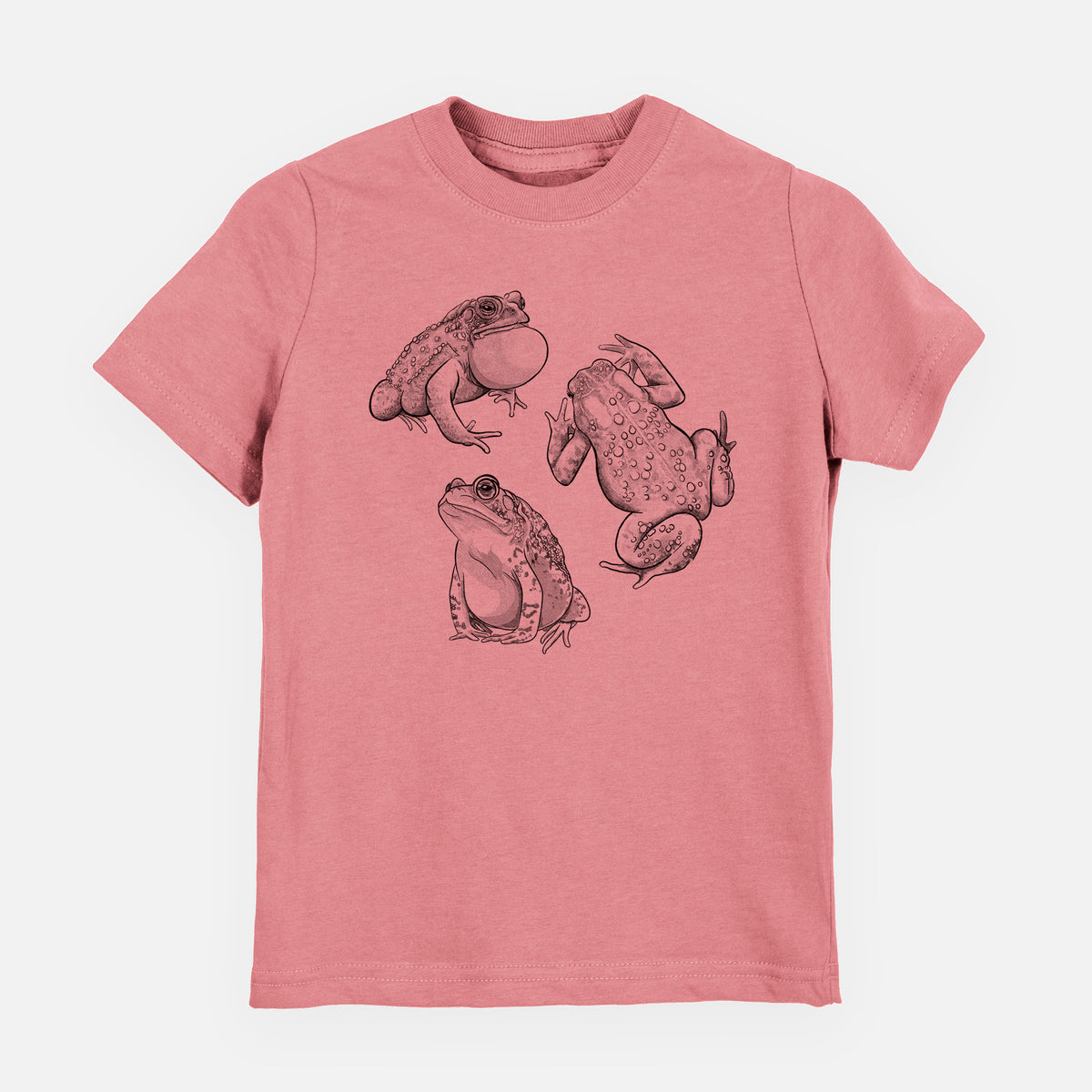 Mauve pink youth t-shirt laid flat, printed with a black ink illustration of three American toads.