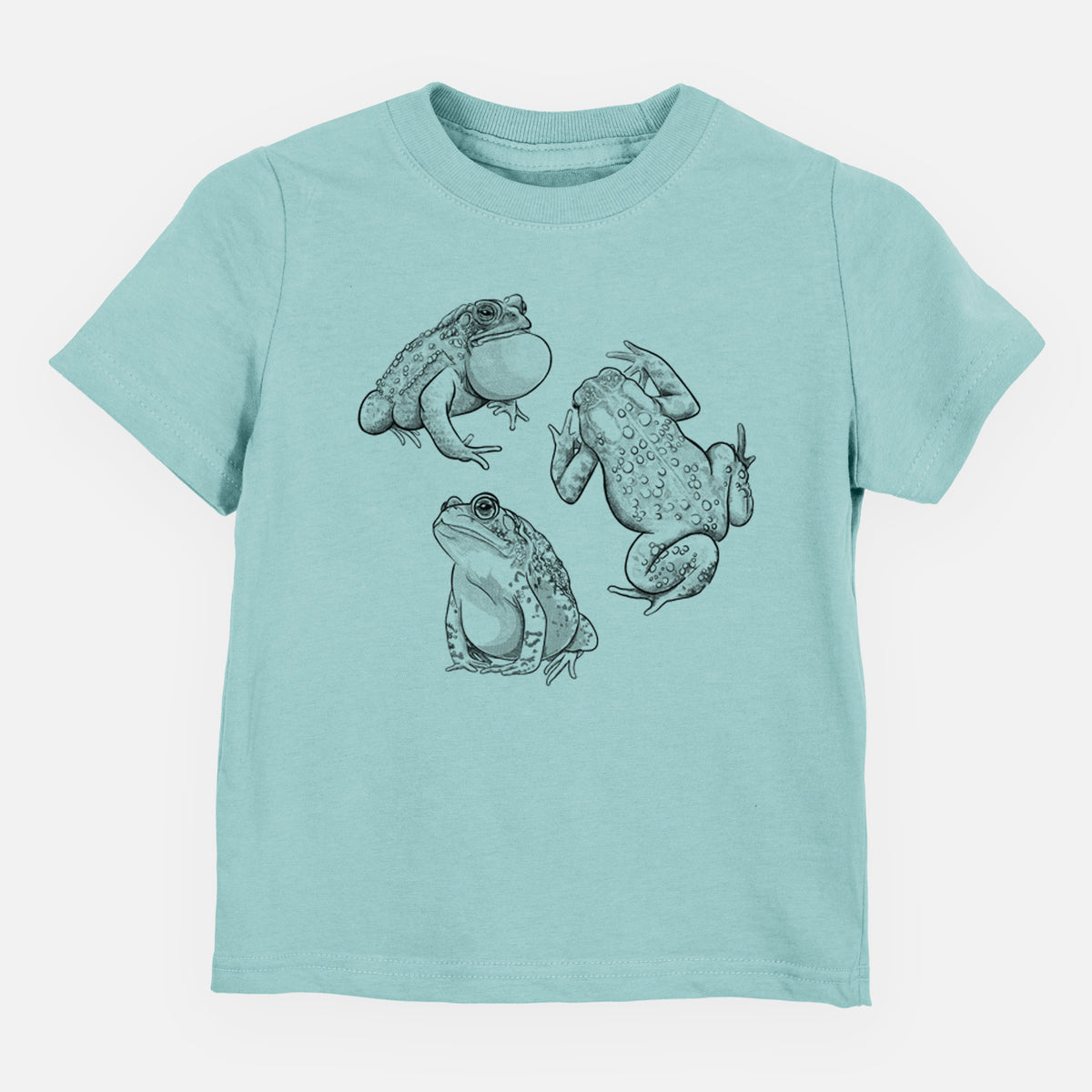 Saltwater toddler t-shirt laid flat, printed with a black ink illustration of three American toads.