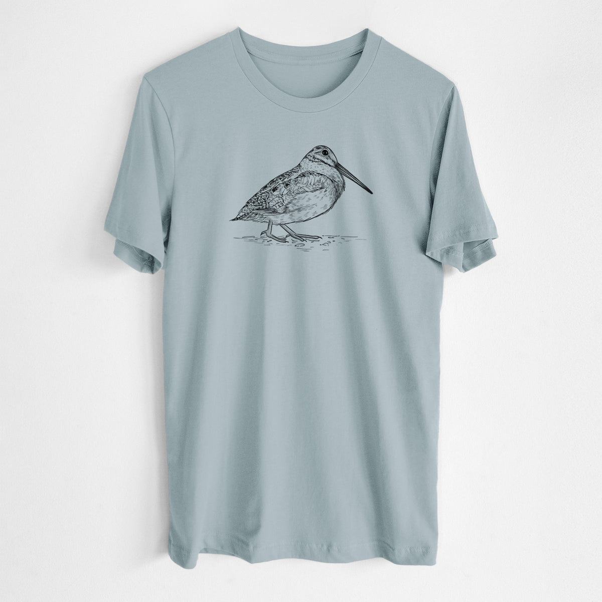 Vintage denim lightweight cotton t-shirt laid flat, printed with a detailed black ink sketch of an American woodcock standing on the ground.